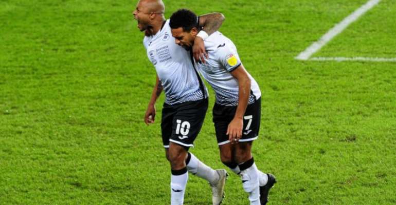 Andre Ayew celebrates with Swansea City teammate
