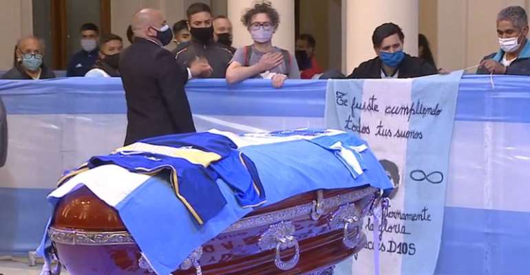 Some fans clapped, others wept, as they filed past Maradona's coffin