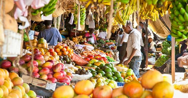 Fruit and vegetables at a market in Kenya. The WHO is pushing for consumption of fresh fruits and vegetables, whole grains, beans, fish and unsaturated fats. - Source: Shutterstock