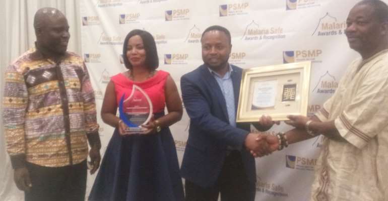 The staff of AngloGold Ashanti (left) receiving their award