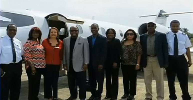*Final picture: Dr Myles Munroe, left of center in a gray jacket, poses with his wife, second left, and members of their congregation. The picture was taken two years