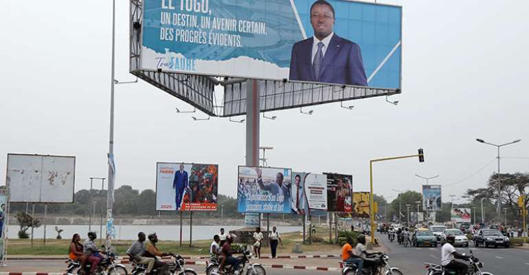 A billboard of President Faure Gnassingbe is seen in Lome, Togo, on February 19, 2020. CPJ recently joined a letter calling for the Togolese government to maintain internet access throughout the upcoming election. (Reuters/Luc Gnago)