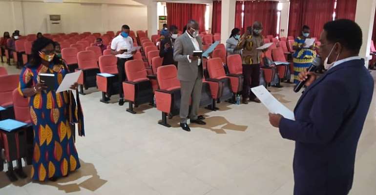 Prof. Yankah swearing in members of the council