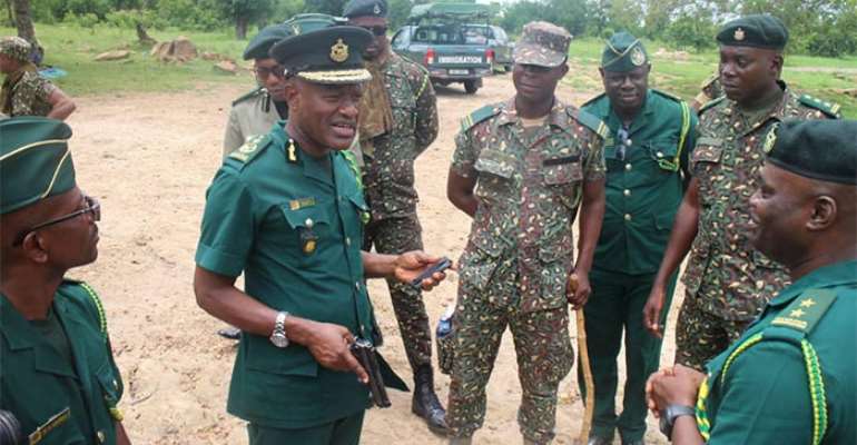 Lawyer, Kwame Asuah Takyi with GIS officers