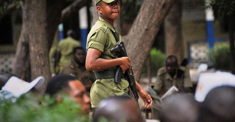 A Tanzanian police officer is seen in Dar es Salaam on October 28, 2015. Tanzanian authorities recently arrested Sebastian Atilio on false news charges. (AP/Khalfan Said)