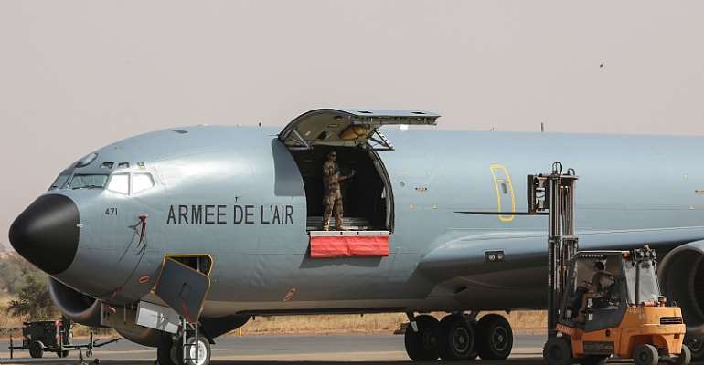 French Air Force soldiers work on a Boeing C135 parked on the French Air Force base in Niamey, Niger in December, 2017. - Source: