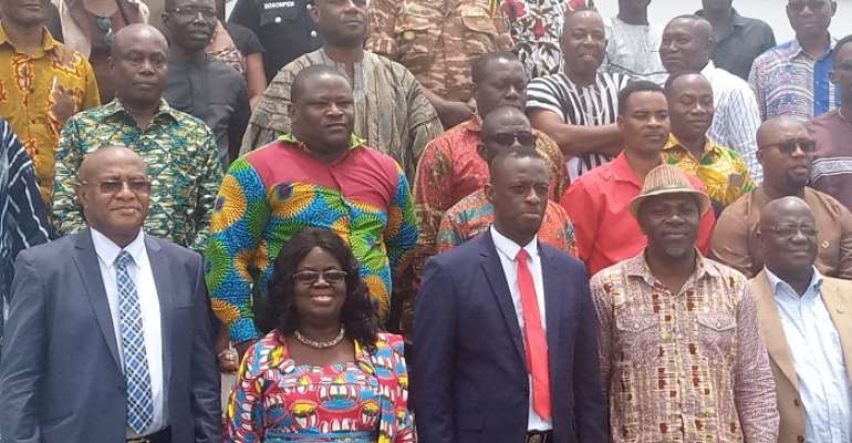 Okyere Darko-Mensah (3rd left) in a photograph with the MMDAs and Heads of Departments