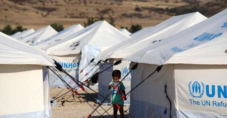 A child in a refugee camp in New Kavala-Greece