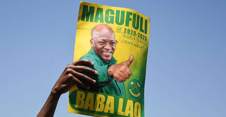 A campaign poster of John Magufuli of the ruling Chama Cha Mapinduzi party who is seeking re-election as president in October. - Source: Ericky Boniphace/AFP via Getty Images)