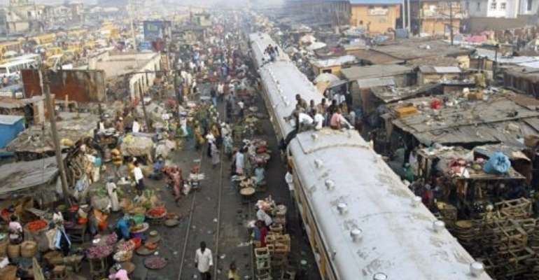 Commuters sit on coaches of a train in Lagos, Nigeria, in 2007. By Pius Utomi Ekpei (AFP/File)
