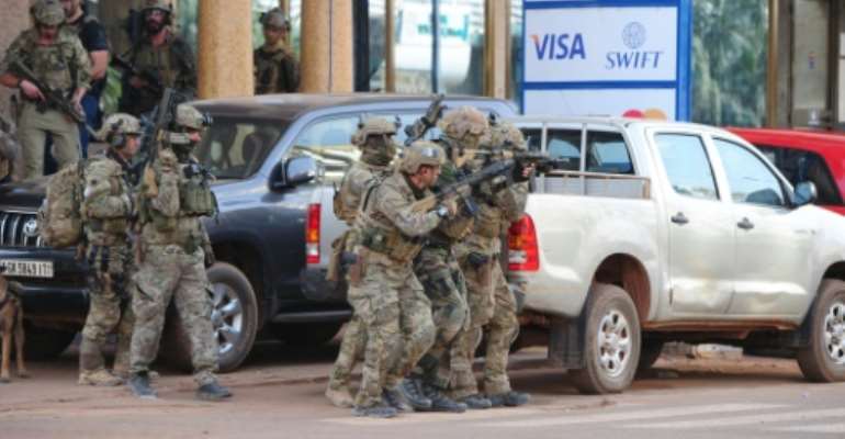 French special forces take position near the Splendid hotel in Ouagadougou on January 16, 2016 following an attack by Al-Qaeda linked gunmen. By Ahmed Ouoba (AFP)