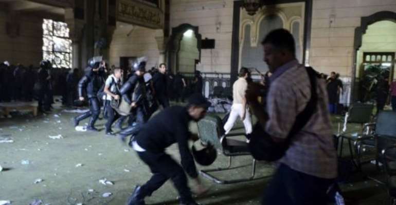Egyptian riot policemen in Cairo's Al-Fath mosque where Islamist supporters of ousted Morsi holed up on August 17, 2013. By Mohamed el-Shahed (AFP/File)