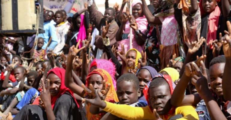 A December 31 file picture shows Sudanese internally displaced people in South Darfur protesting against the end of the United Nations and African Union peacekeeping mission. By - (AFP/File)