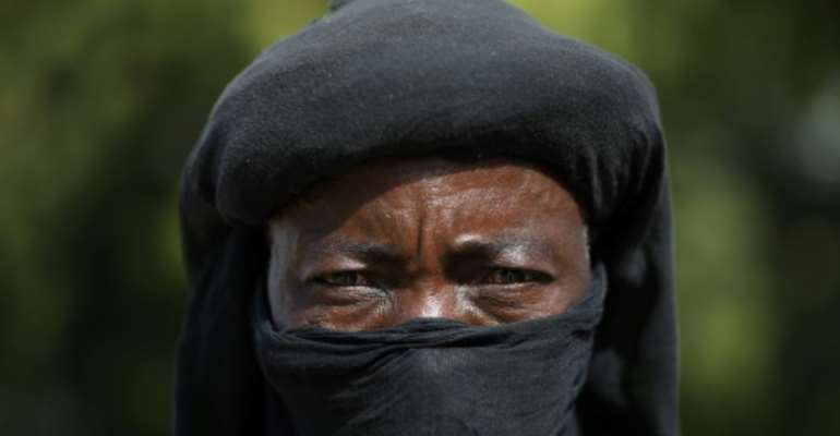 A member of the Yansakai vigilante group. By Kola Sulaimon (AFP)