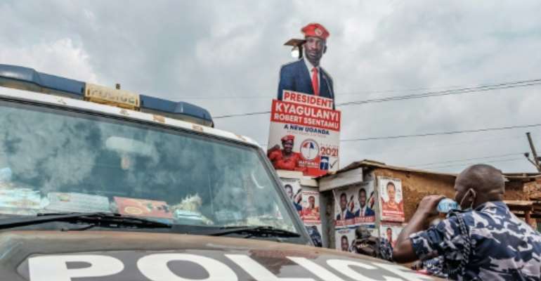 A police patrol car stationed outside the headquarters of Uganda's main oppposition party, the National Unity Platform. By SUMY SADURNI (AFP)