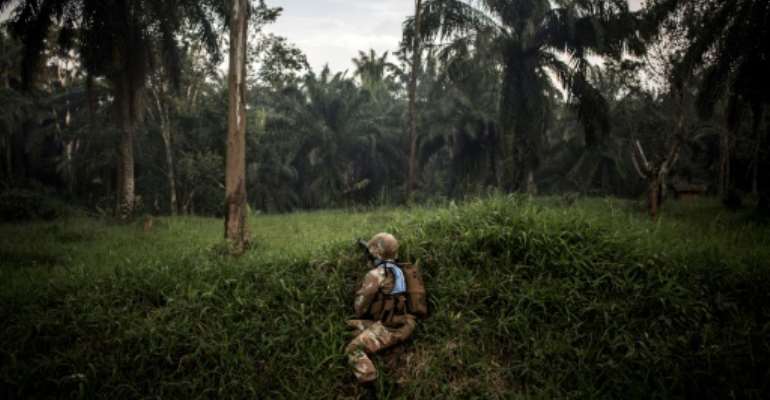 A soldier from the UN's DR Congo mission patrols for members of the ADF militia, which is thought to have killed more than 700 civilians since 2014. By JOHN WESSELS (AFP)