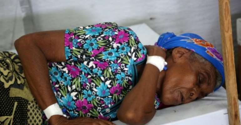 A woman is treated in the Yemeni coastal city of Hodeida, which has seen cases nearly triple in the past three months alone as conflict helps to spread the disease. By ABDO HYDER (AFP)