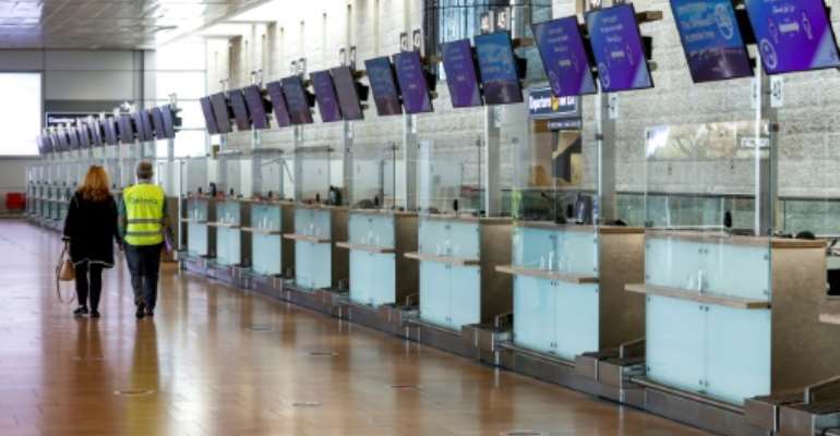 Airports are empty as borders are being clamped shut with countries racing to get a grip on mushrooming coronavirus infections. By JACK GUEZ (AFP)