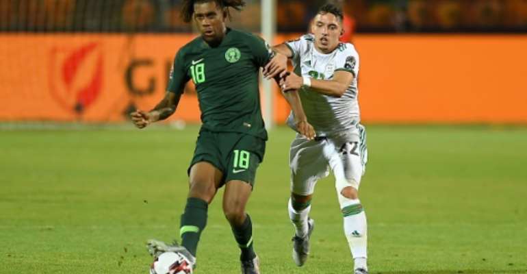 Alex Iwobi (L) scored twice as Nigeria took a four-goal lead before collapsing in a 4-4 draw against Sierra Leone Friday.. By MOHAMED EL-SHAHED (AFP)