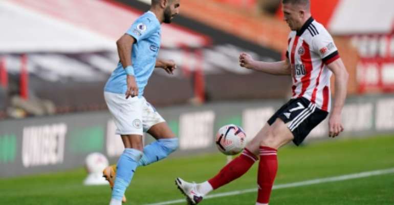 Algeria captain and Manchester City winger Riyad Mahrez (L) calls national coach Djamel Belmadi a