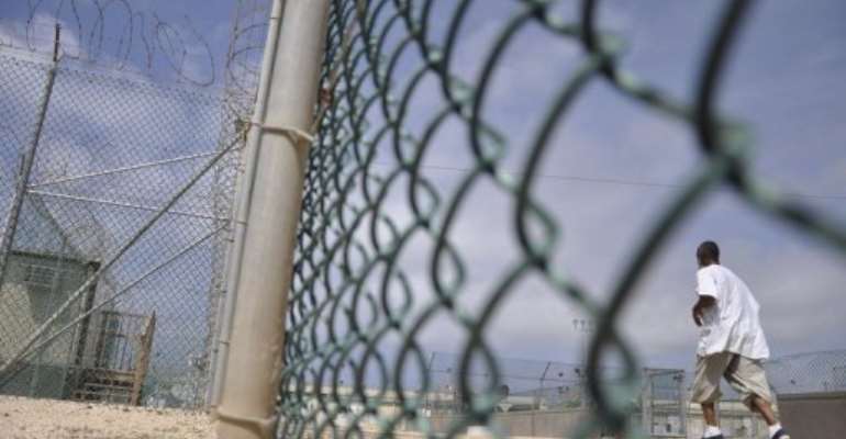 A Guantanamo detainee runs inside an exercise area at the detention facility at Guantanamo Bay. By Michelle Shephard (AFP/POOL/File)