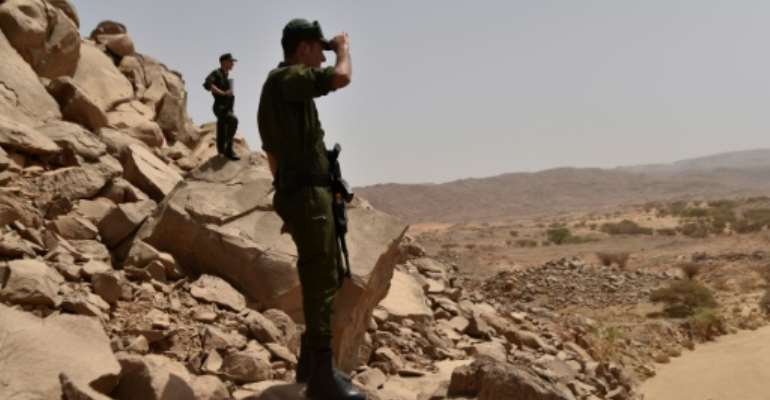Algerian security forces patrol in the desert some 2,000 kilometres south of the capital Algiers on July 2, 2018. By RYAD KRAMDI (AFP/File)