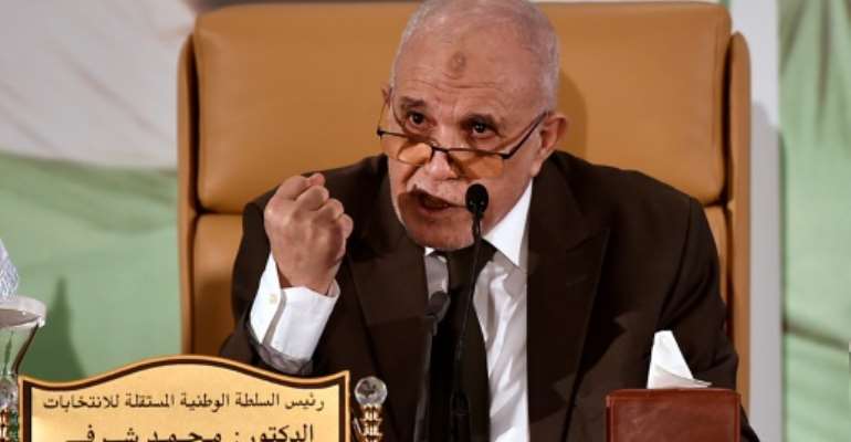 Algeria's electoral authority chief Mohamed Charfi announces the result of the referendum on a revised constitution boycotted by the Hirak grassroots protest movement. By RYAD KRAMDI (AFP)