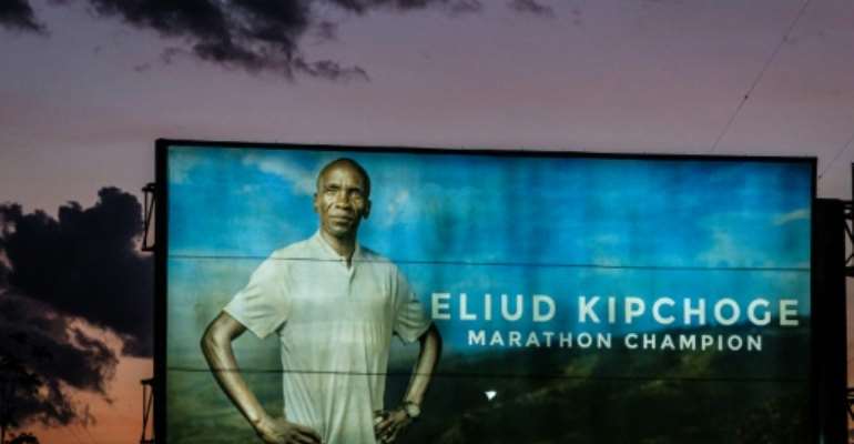 An advertising billboard in Kenya shows Olympic marathon champion and World record holder Eliud Kipchoge who will attempt to break the two-hour marathon barrier on Saturday. By Yasuyoshi CHIBA (AFP)