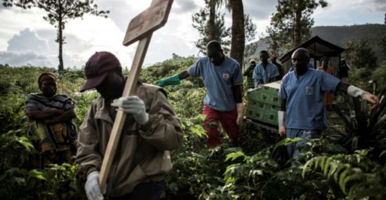 An Ebola victim is buried in Butembo, eastern DR Congo. More than 2,100 people have died in the 14-month-old epidemic. By JOHN WESSELS (AFP)