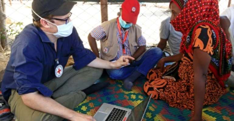An Ethiopian refugee sends her mother a message through the International Committee of the Red Cross, after fleeing the northern Tigray region into neighbouring Sudan. By ASHRAF SHAZLY (AFP)