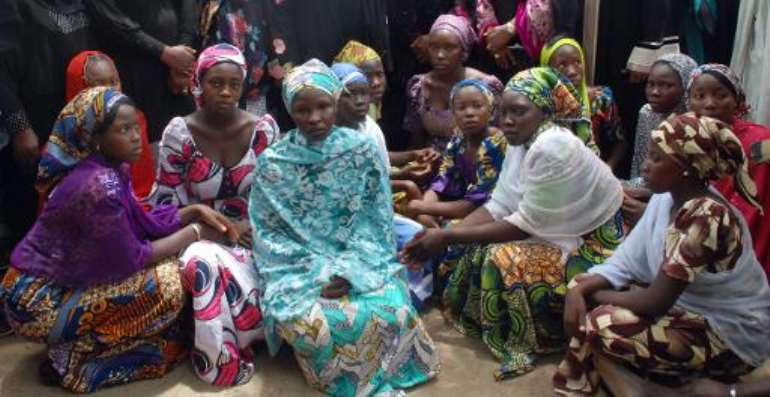 Chibok school girls who escaped from the Boko Haram Islamists gathering to receive informations from officials, on May 5, 2014. By (AFP/File)