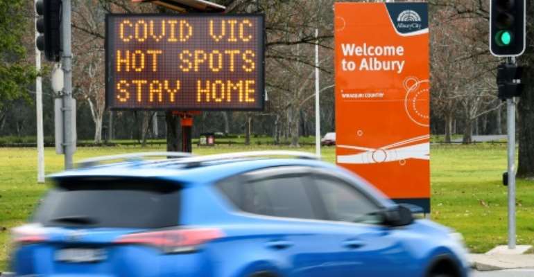 Australia has ordered millions locked down in its second-biggest city, and effectively sealed off Victoria state to combat a new coronavirus surge. By William WEST (AFP)
