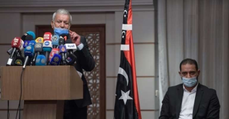 Bachir al-Haouch (L) and Abdelmonem al-Sherif hold a press conference in the Tunisian capital. By FETHI BELAID (AFP)