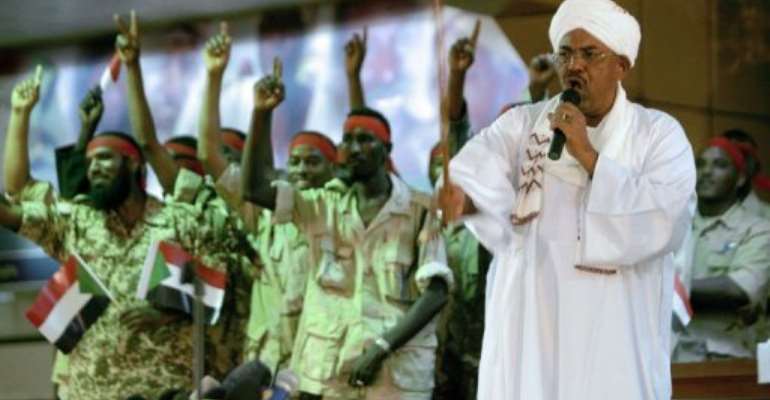 Sudanese President Omar al-Bashir speaks at the National Congress Party headquarters. By Ashraf Shazly (AFP)