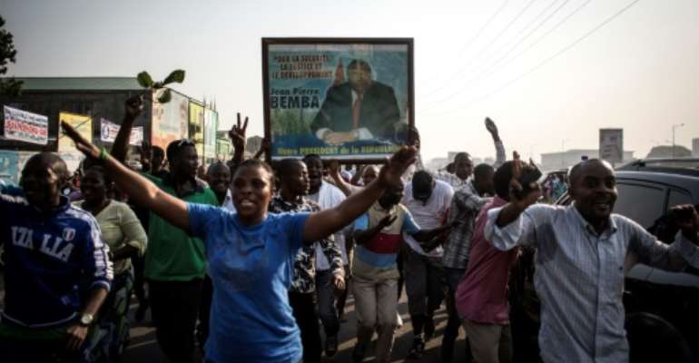 Bemba's supporters celebrate in Kinshasa on June 8 after he was acquitted on appeal. By JOHN WESSELS (AFP/File)
