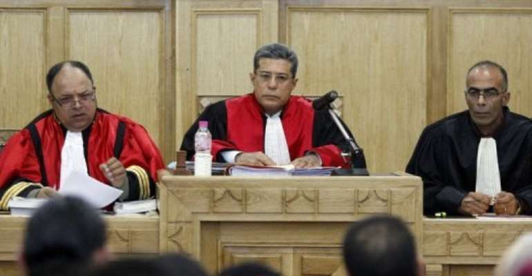 Tunisian military judge Hedi Ayari (C) addresses a military court. By Salah Habibi (AFP/File)