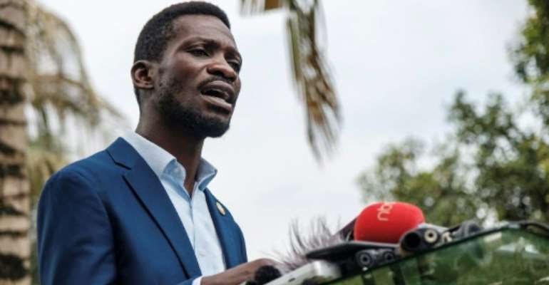 Bobi Wine, pictured last Friday at a press conference at his home in Magere, on the outskirts of Kampala. By Sumy SADRUNI (AFP)
