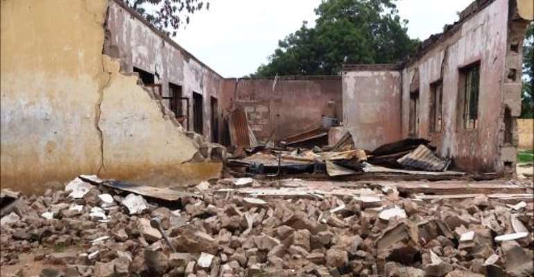 This picture taken on August 6, 2013 shows a blown up students hostel in the Government Secondary School of Mamudo, in the northeastern Nigerian Yobe state, after an attack by Boko Haram gunmen. By Aminu Abubakar (AFP/File)