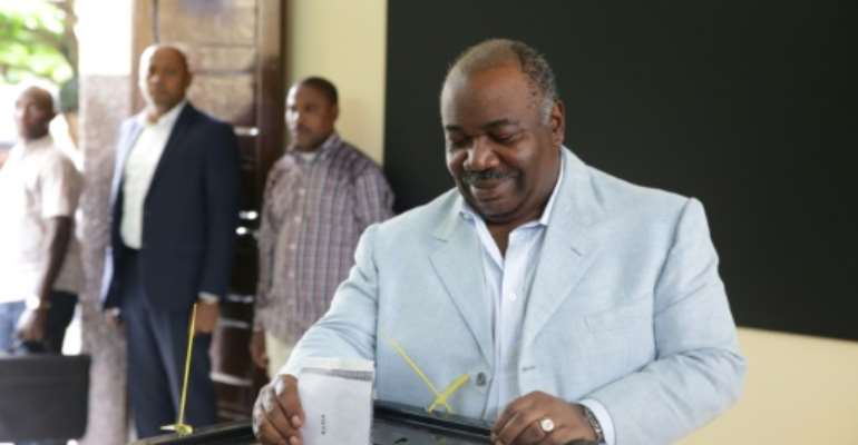 Bongo is shown casting his ballot on Saturday. Gabon has been ruled by the same political dynasty for nearly half a century. By Joel TATOU (AFP)