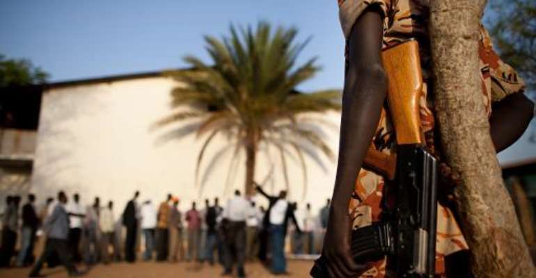 Southern Sudanese police stand guard outside a polling station in Juba on January 9, 2011. By Trevor Snapp (AFP/File)