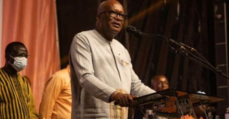 Burkina Faso President Roch Marc Christian Kabore addresses supporters during a celebration at his party’s headquarters in Ouagadougou on November 26, 2020. By OLYMPIA DE MAISMONT (AFP/File)