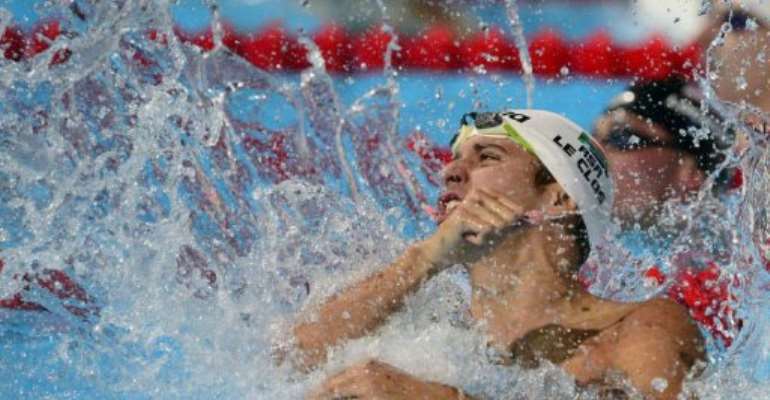 South Africa's Chad Le Clos celebrates after winning the final of the men's 100-metre butterfly, August 3, 2013. By Lluis Gene (AFP)