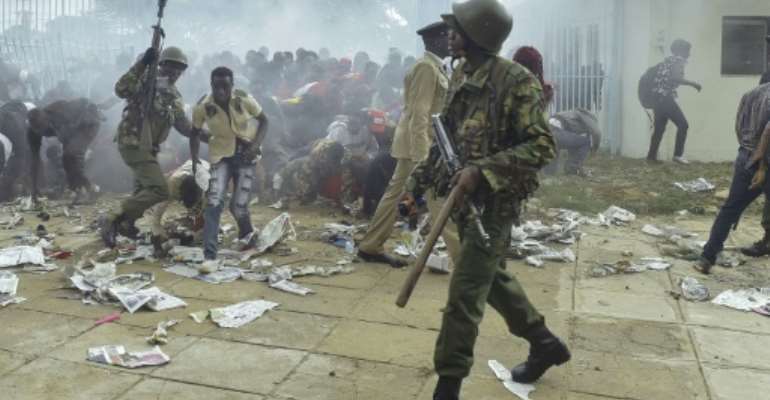Chaos erupted at Kenya's Kasarani stadium in Nairobi as supporters of President Uhuru Kenyatta tried to get into the venue to attend his inauguration ceremony. By SIMON MAINA (AFP)