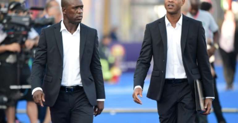 Clarence Seedorf and his assistant Patrick Kluivert arrive for the match against Nigeria in Africa Cup of Nations round of 16, their last in charge of Cameroon. By JAVIER SORIANO (AFP/File)