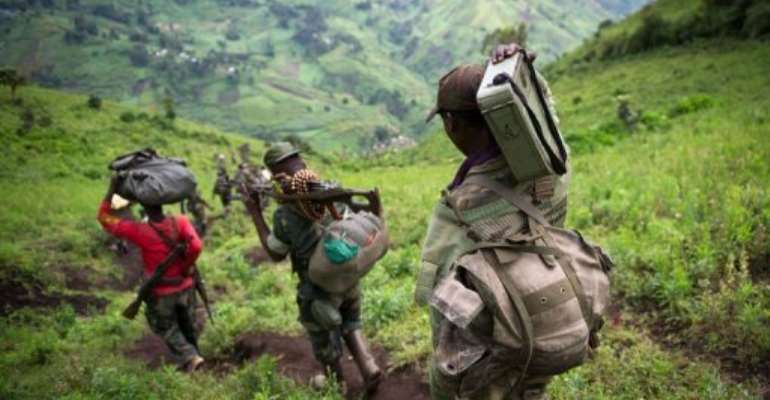 M23 rebels leave their position in the village of Karuba, eastern Democratic Republic of Congo, on November 30, 2012. By Phil Moore (AFP/File)