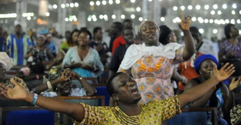 'Crossover' is an eagerly-awaited moment for many Nigerian Christians. Congregations pray throughout the night on New Year's Eve that the coming year will be good. By PIUS UTOMI EKPEI (AFP)
