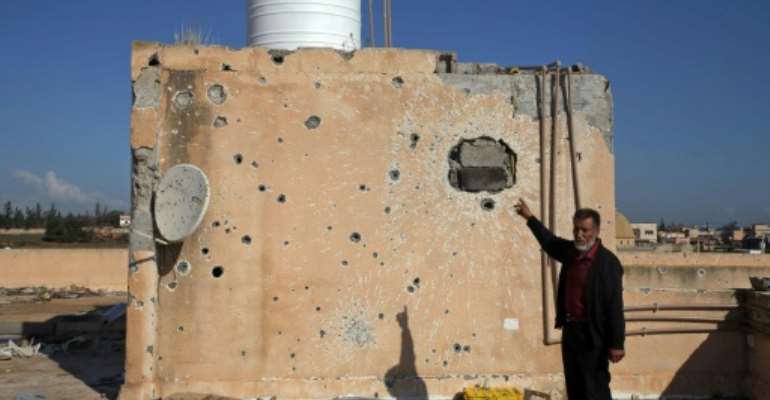 Damage at the Martyrs school, on the outskirts of Tripoli -- one of around 100 schools partially or totally destroyed during a year-long fight for Libya's capital. By Mahmud TURKIA (AFP)