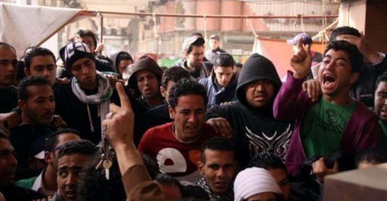 People protest in Egypt's Port Said on January 26, 2013 after a court in Cairo sentenced 21 people to death. By (AFP)
