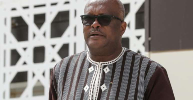 Despite criticism over his failure to stem jihadist violence, Kabore scored a massive victory in the first round of voting on Sunday. By Ludovic MARIN (POOL/AFP)