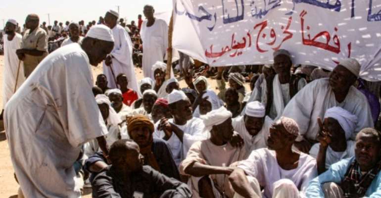 Displaced Darfuris stage a sit in to protest against the withdrawal of the United Nations-African Union peacekeeping mission. By - (AFP)